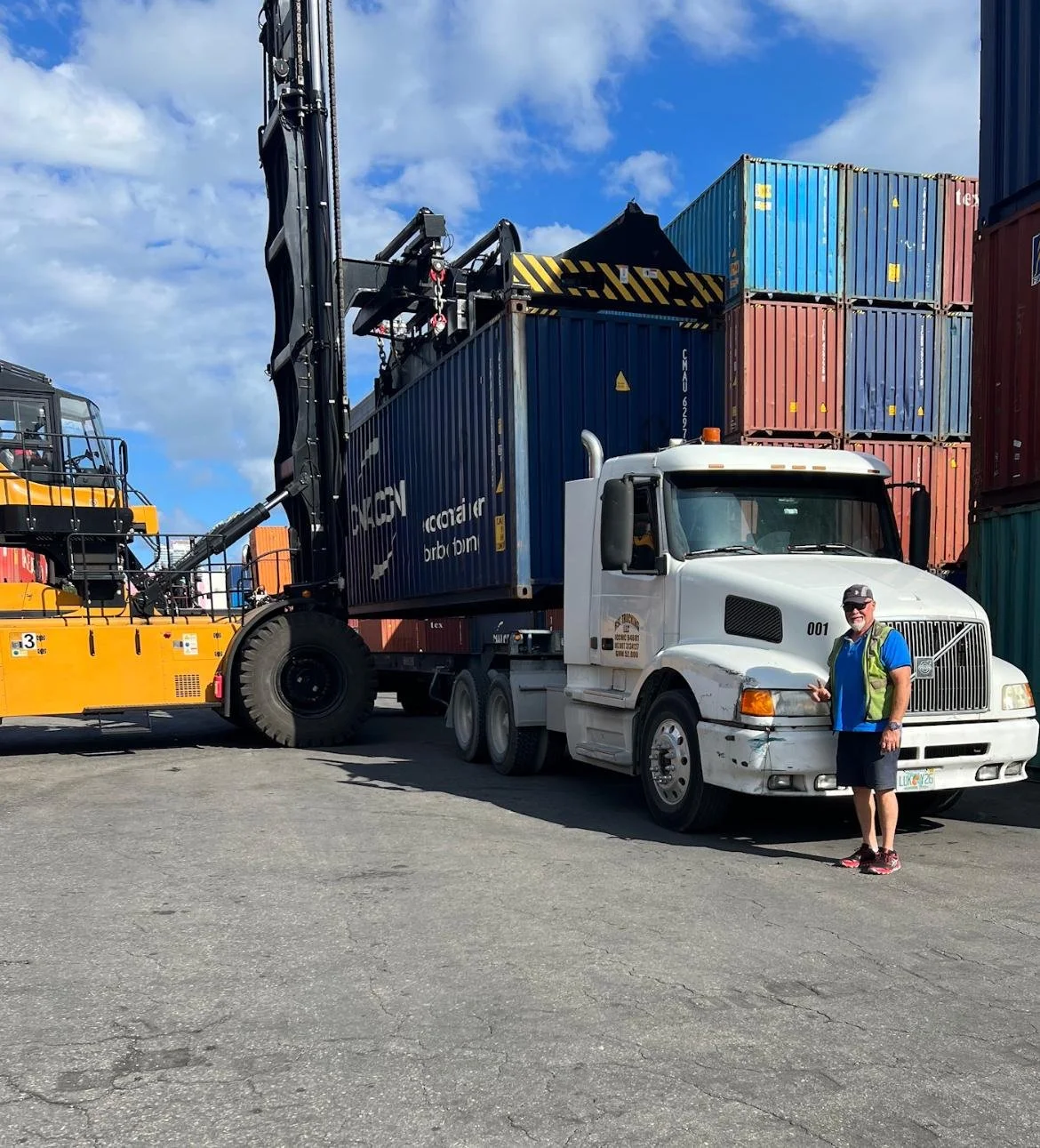 shipping+container+being+delivered+at+a+port+terminal+for+international+container+shipping